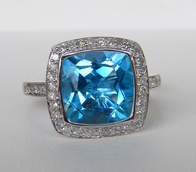 blue topaz and diamond halo ring white gold