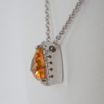 side view of citrine and diamond pendant