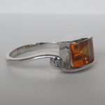 side view of white gold citrine ring with diamond accent