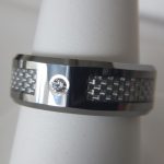 mens wedding band with a single diamond in the center