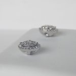side view of white gold diamond cluster earrings