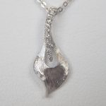 white gold diamond leaf pendant