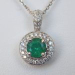 white gold emerald and diamond pendant