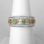 white and yellow gold emerald and diamond band