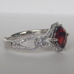 side view of white gold garnet and diamond ring