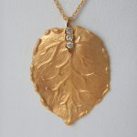 yellow gold diamond leaf pendant