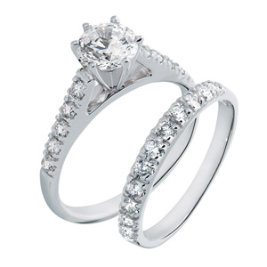 prong set diamond accented engagement ring
