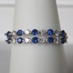 sapphire and diamond band in white gold setting