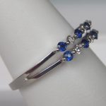 side view of white gold sapphire and diamond band