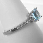 side view of white gold aquamarine and diamond ring