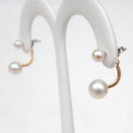 side view of yellow gold pearl earring jackets