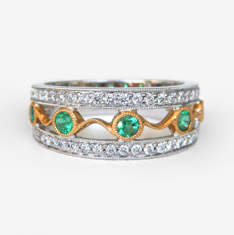 Click to view larger size white and yellow gold emerald and diamond band