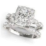 white gold diamond halo engagement ring with matching wedding band