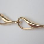 close up view of yellow gold link bracelet