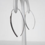 side view of white gold wire earrings
