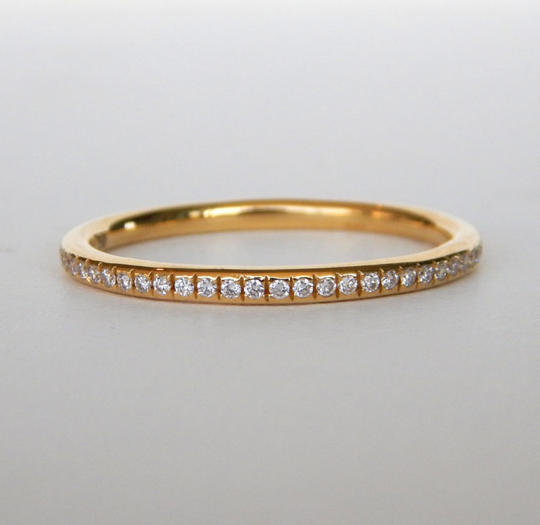 yellow gold bead set diamond band