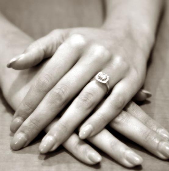 hand with an engagement ring