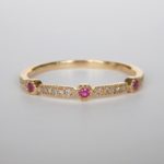 yellow gold ruby and diamond band with milgrain edges