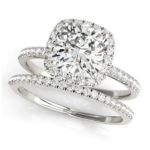 cushion cut diamond halo engagement ring with matching wedding band