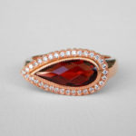 rose gold pear shaped garnet and diamond halo ring