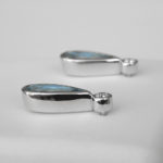 side view of white gold aquamarine and diamond earrings