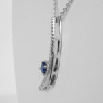 side view of white gold sapphire and diamond pendant