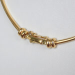 close up view of yellow gold necklace clasp