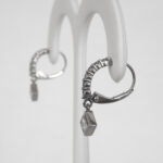 side view of white gold diamond leverback dangle earrings