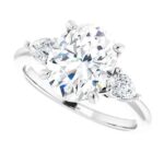 three stone oval diamond engagement ring with pear accented diamonds