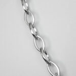 close up view of sterling silver fancy link necklace