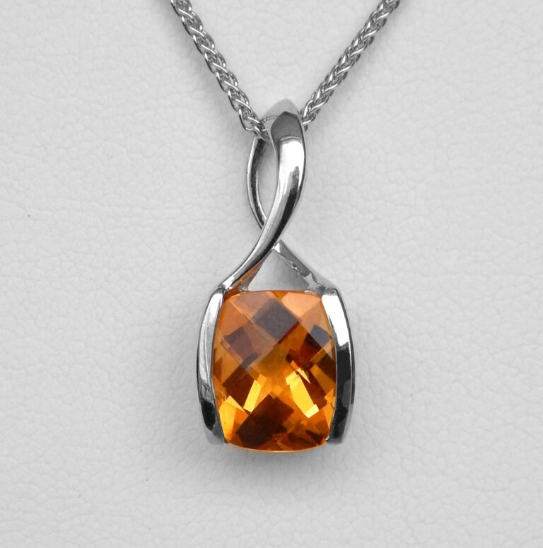 close up view of white gold citrine pendant