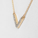 side view of yellow gold diamond chevron necklace