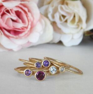 amethyst solitaire stacking ring in yellow gold