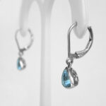 side view of aquamarine dangle earrings