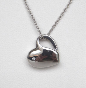 close up view of sterling silver diamond heart pendant