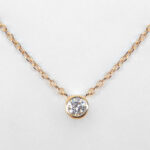 close up view of diamond solitaire necklace