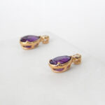 side view of yellow gold amethyst earrings