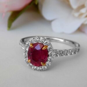 white gold oval ruby and diamond halo ring