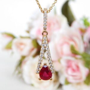 yellow gold pear shape ruby and diamond pendant