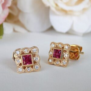 yellow gold ruby and diamond milgrain edge earrings