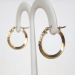 side view of knife edge diamond cut hoop earrings