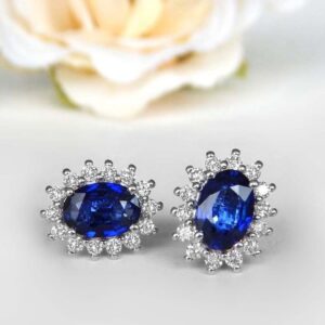 white gold oval sapphire and diamond halo earrings