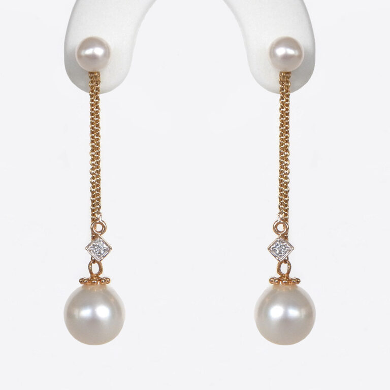 pearl and diamond dangle earrings in yellow gold