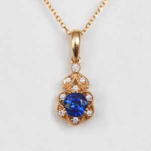 yellow gold sapphire and diamond art deco pendant