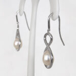 side view of pearl dangle earrings