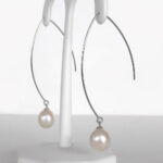 side view of pearl dangle earrings