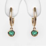 yellow gold emerald huggie earrings