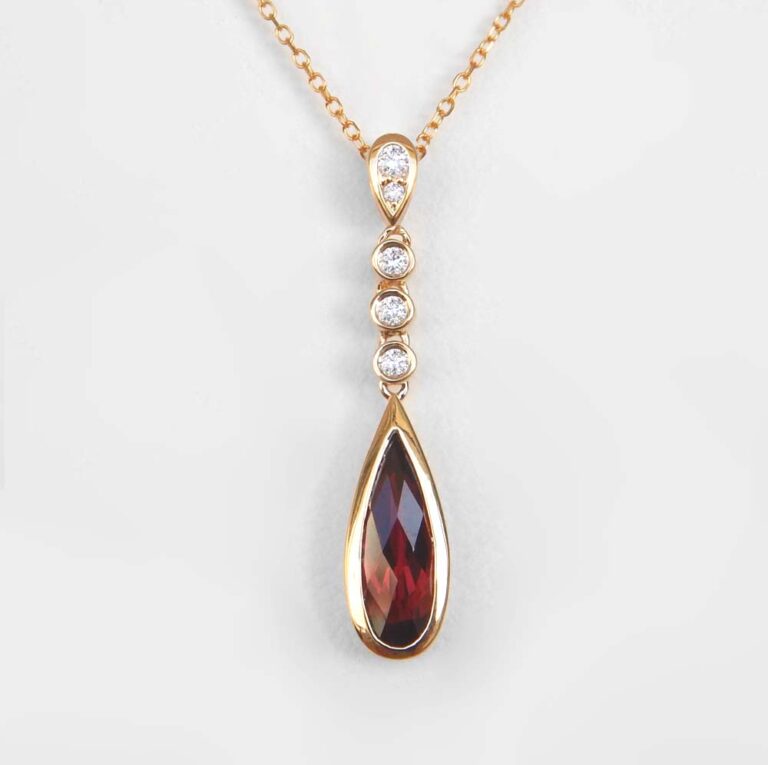 yellow gold pear shape garnet and diamond drop pendant