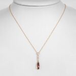 yellow gold garnet and diamond drop pendant on chain