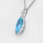 side view of white gold blue topaz and diamond pendant